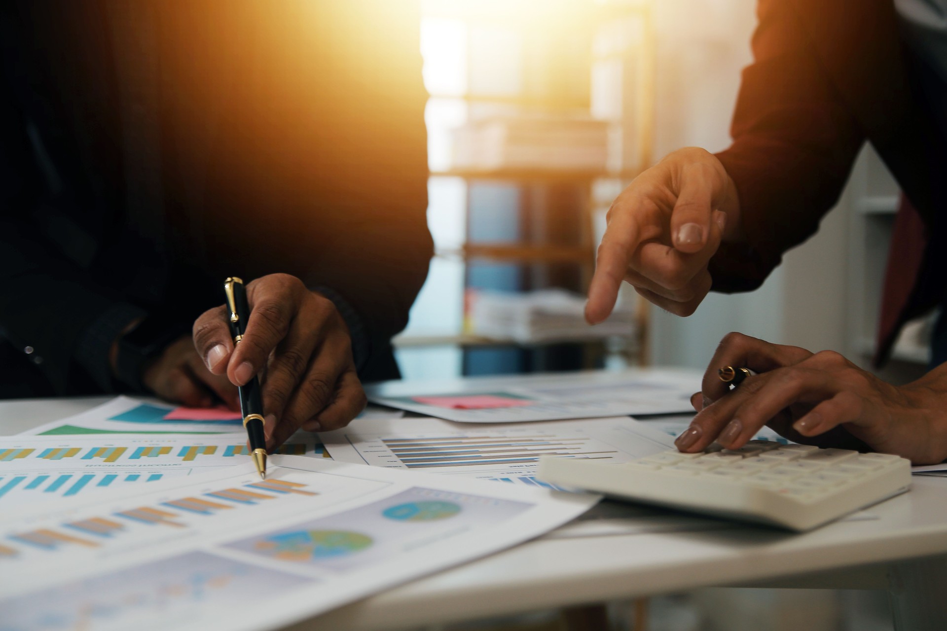 Fund managers team consultation and discuss about analysis Investment stock market at office